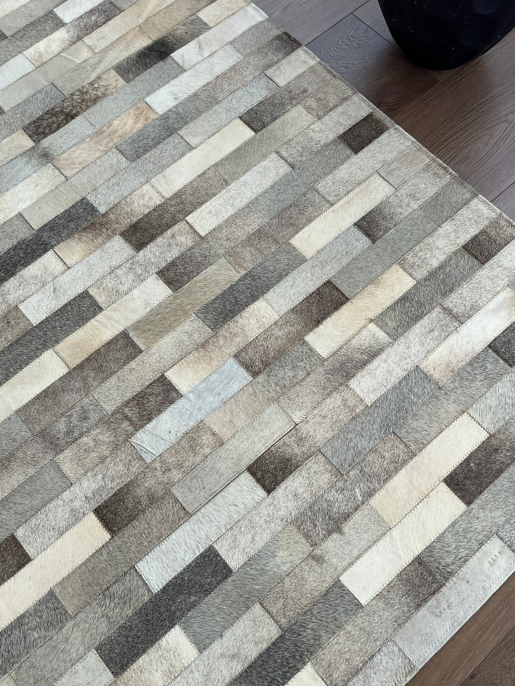 Patterned rug with geometric design on a floor