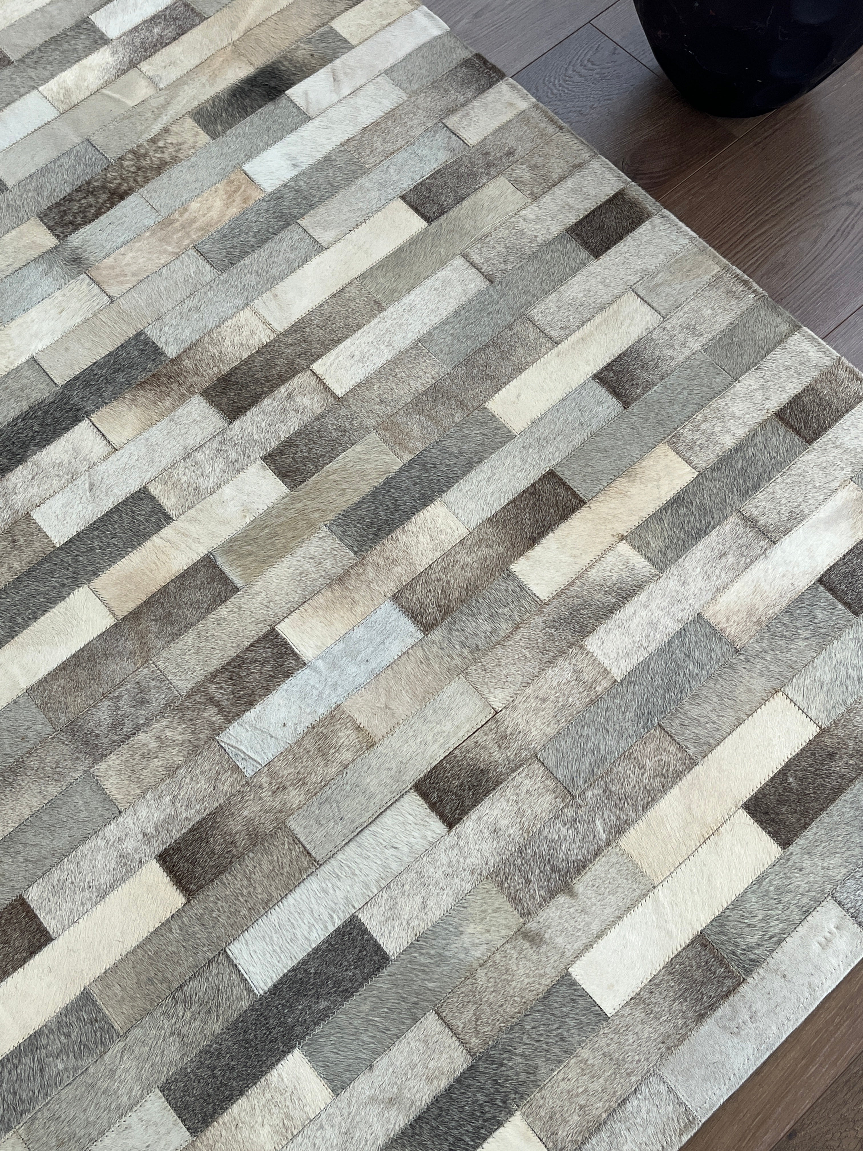 Patterned rug with geometric design on a floor