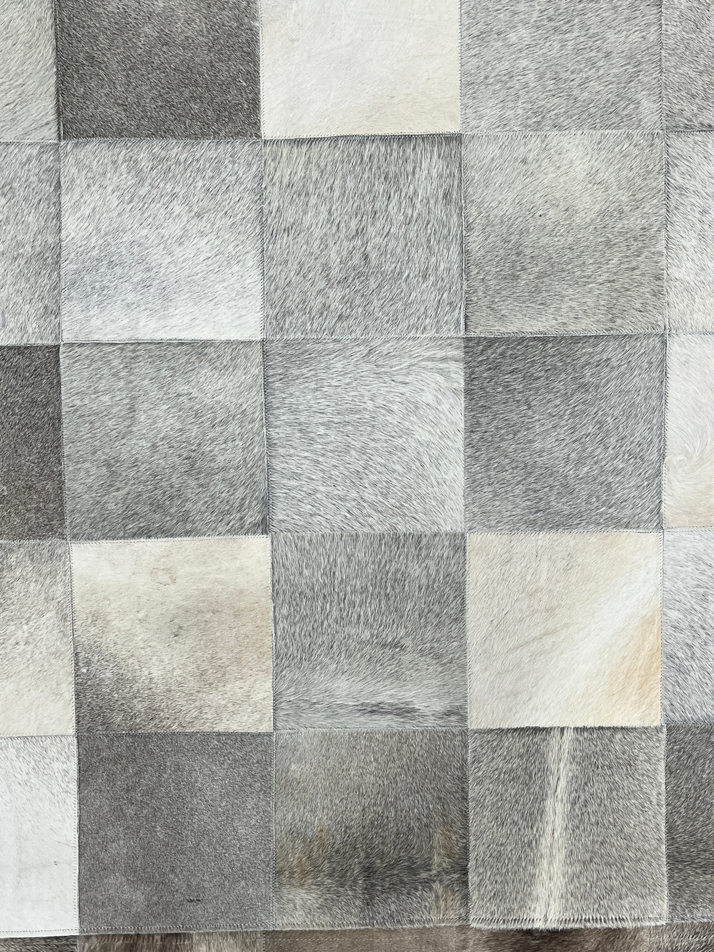 Checkered pattern of gray and white tiles