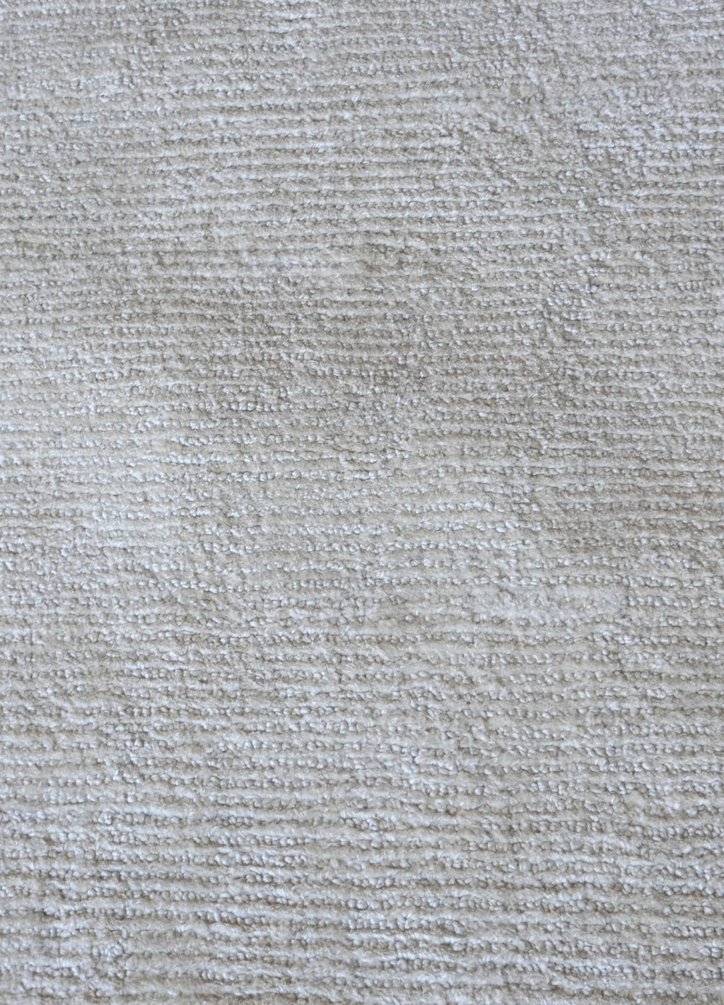 Close-up of a textured gray fabric surface