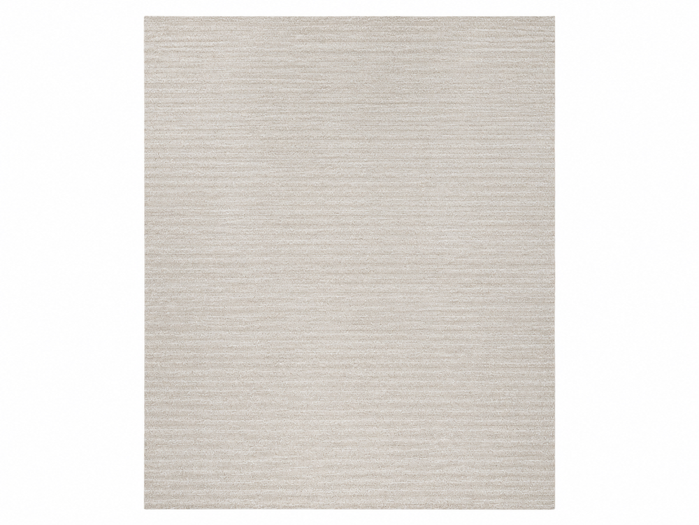 Beige area rug with a subtle pattern on a white background