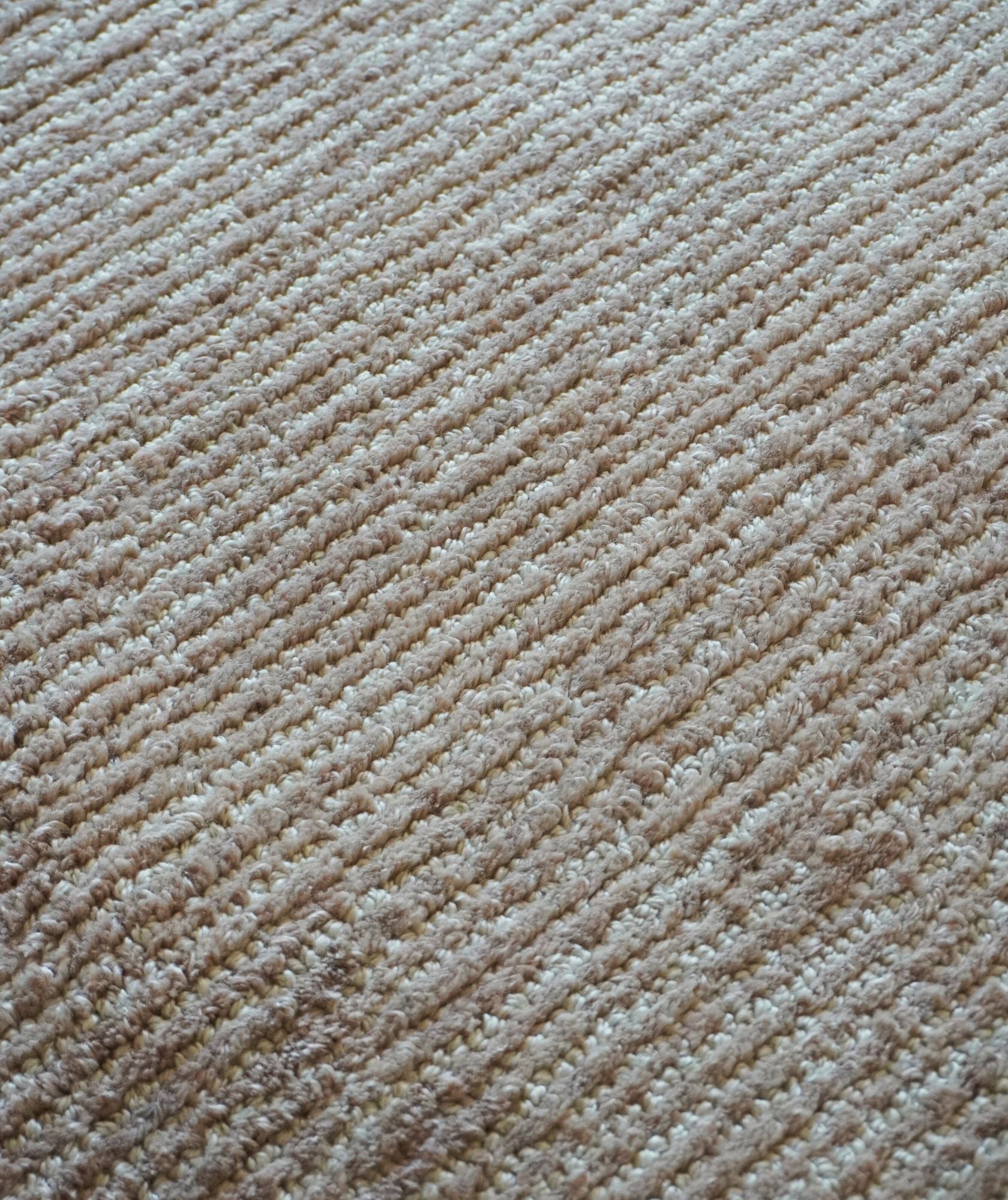 Close-up of beige carpet texture